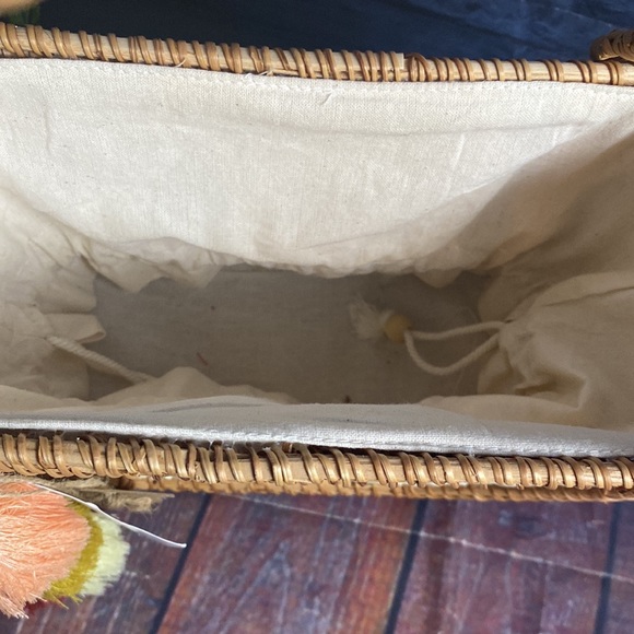 Crescent Woven Handbag with tassel detail and cinch bag interior - Picture 4 of 11